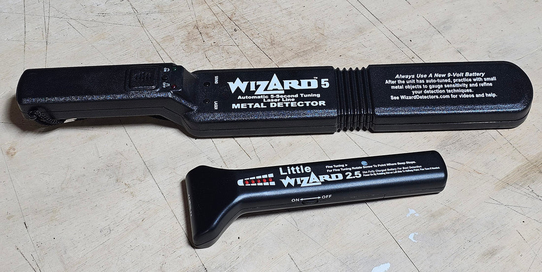 Lumber Wizard 5 and Little Wizard 2.5 woodworking metal detectors on a workbench