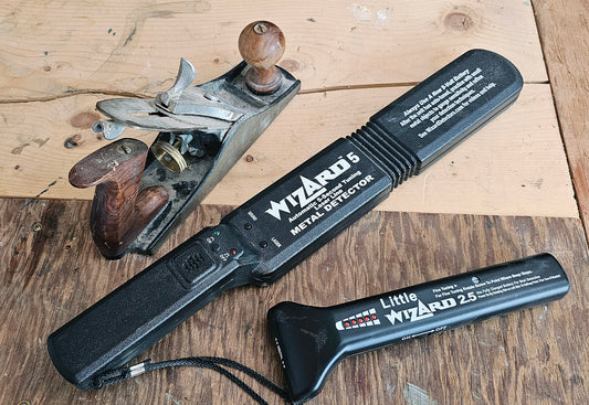 Vintage hand plane with Lumber Wizard 5 and Little Wizard 2.5 metal detectors on weathered reclaimed wood