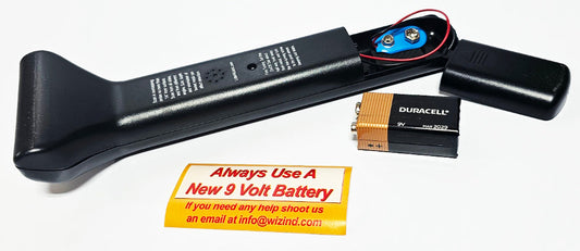 Little Wizard 2.5 metal detector with battery compartment open, fresh Duracell 9V battery and Always Use A New 9-Volt Battery card
